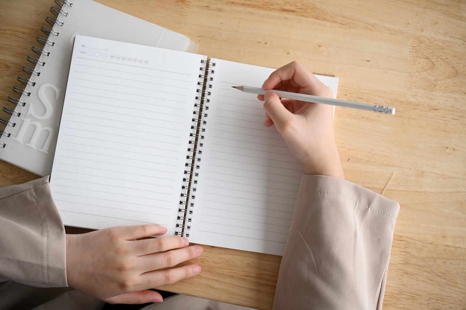 Female Writing an Essay, Taking Notes, Doing Homework on Spiral